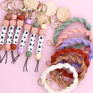 Braided wristlet keychain with silicone beads and MAMA letter charms in soft tones