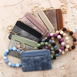 Fashionable zipper card holder wallets with silicone bead wristlets in assorted colors