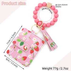 Pink strawberry print card wallet with silicone beaded bracelet and tassel showing dimensions