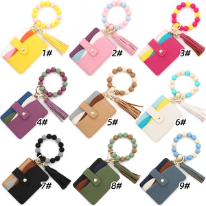 Detail view of colorful silicone bead bracelet keychain sets with textured card holders