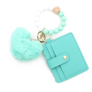 Mint green silicone bead bracelet keychain with fuzzy heart pompom and card holder
