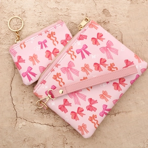 Roze imitatieleer clutch set met strikprint, polsbandje en kleine muntenportemonnee