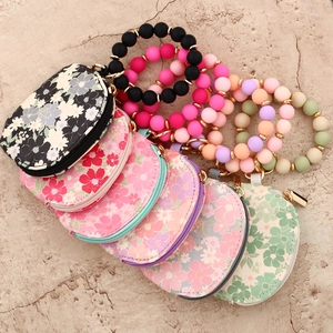Floral waterproof wristlet wallet with silicone bead keychain and gold zipper