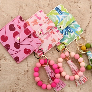 Silicone bead keychain bracelet with printed PU leather card holder and tassel charm