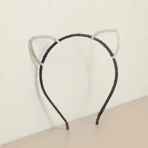 Detailed view of the sparkling rhinestone cat ear headband with a black slim frame