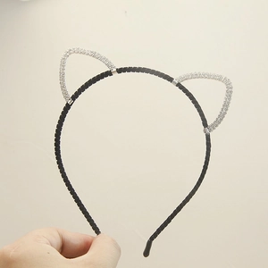 Detail of cute cat ear headband featuring silver crystals and non-slip black spiral texture