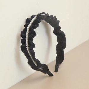 Elegant black velvet pleated headband with pearl accents for minimalist styling