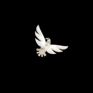 Elegant eagle brooch with natural shell wings and sparkling crystals on golden base