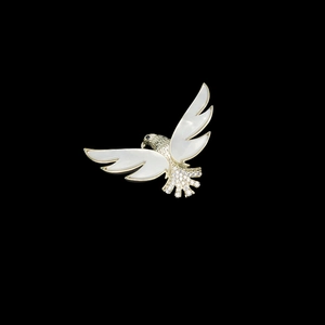 Elegant gold eagle brooch with white shell wings and shimmering zircon stones for women