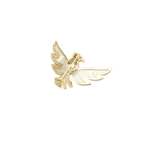 Detail view of golden eagle brooch with white shell wings and secure pin clasp