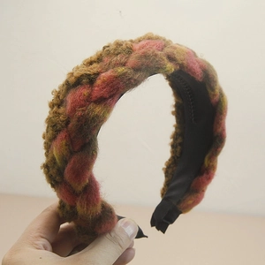 Detail of bohemian braided headband showing multi-color knit fabric and anti-slip teeth