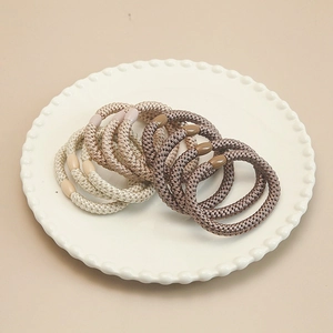 Detail of 10-piece set of woven high-elastic hair scrunchies in earthy neutral tones