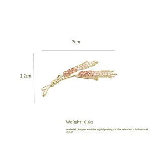 Detailed macro view showing the 7cm golden wheat brooch size and premium zircon inlay