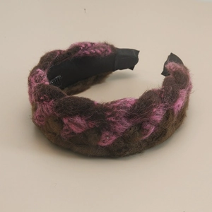 Detail of bohemian braided wide headband with brown and pink textured knit fabric