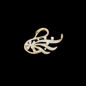 Luxurious golden swan brooch with white cubic zirconia inlay on a black background