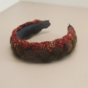 Detail of vintage braided headband featuring brown faux fur and black-red tweed textures