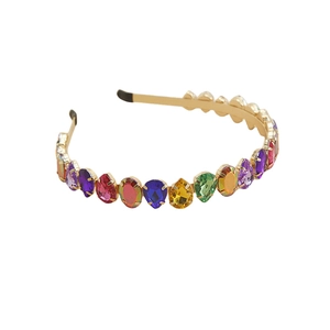Close-up of teardrop multi-color rhinestones on a gold metal headband design