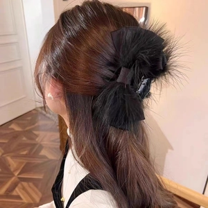 Elegant large black feather bow hair claw clip accessory for autumn and winter hairstyles