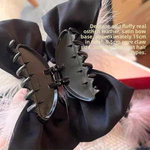 Detail of 15cm bow hair claw with ostrich feathers and satin ribbon measurements