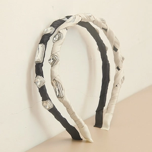 Elegant baroque crystal headbands in black and beige satin fabric with rhinestones