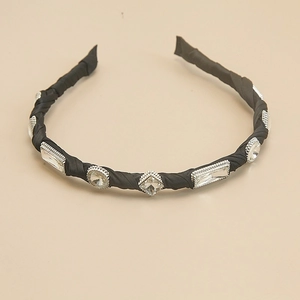 Detailed macro view of baroque crystal headband with silver metal claw settings