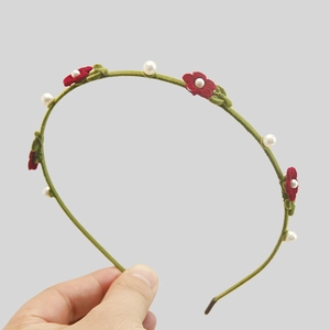Retro green flocked headband with red floral accents and white pearl beads for women