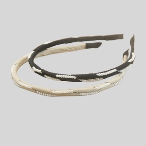 Elegant narrow black and beige fabric headbands with white faux pearl embellishments