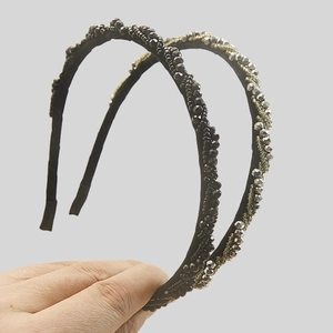 Set of two minimalist beaded headbands featuring elegant black and gold crystals for daily wear