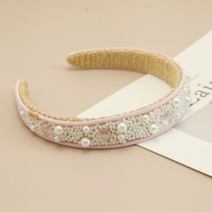 Elegant wide headband featuring pink fabric with sparkling pearls and crystals in palace style