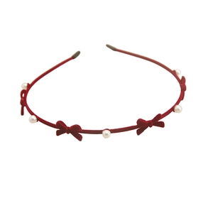 Retro red velvet headband with bows and white pearls on minimalist thin metal frame