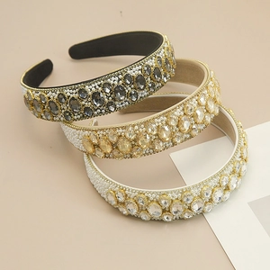 Detailed view of luxury baroque headbands with oval crystals and faux pearls