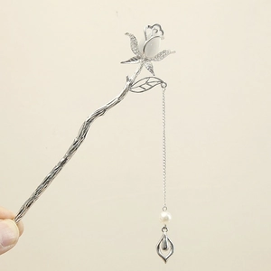 Detail view of silver rose hairpin with pearl tassel and butterfly design for Hanfu styles