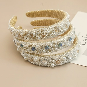 Detailed close-up of handmade baroque headbands with pearls and faceted crystals