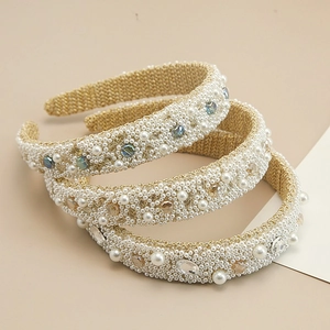 Detail of baroque pearl headbands with crystals on a golden woven base for women