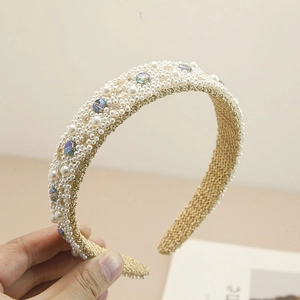 Detail of handcrafted gold braided headband with gradient pearls and faceted crystals