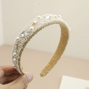 Detailed macro of Baroque pearl headband with ivory faux pearls and clear crystals