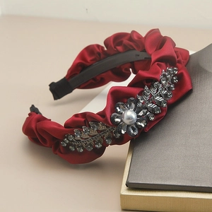 Luxurious burgundy pleated satin headband with rhinestone leaf and pearl decoration