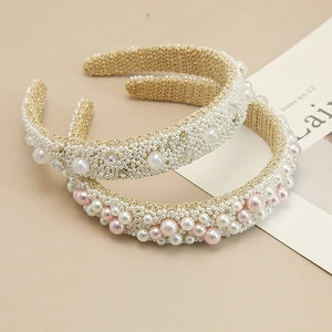Detail shot of baroque style handmade pearl headband with gold wire and crystals