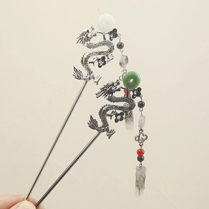 Detail of silver dragon hairpins with jade beads and elegant long tassels for Hanfu style