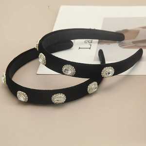 Elegant black velvet headband set with large oval crystals and sparkling rhinestones