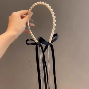 Elegant pearl headband with black velvet bow and sparkling rhinestone tassel fringe