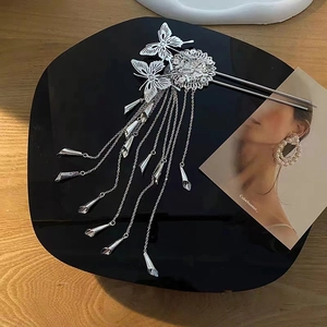 Elegant butterfly hair pin with cascading metal tassels and hollow butterfly design