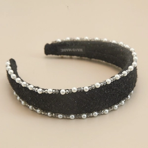 Detailed close-up of handmade black tweed headband with faux pearls and crystals