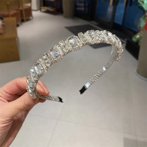 Detail view of the silver headband showing luxurious rectangular crystals and rhinestones