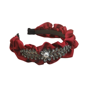 Elegant red pleated satin headband with rhinestone leaf design and faux pearl center