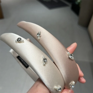 Puffy satin padded headband set with elegant pearls and rhinestones in champagne and cream