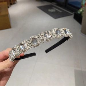 Close-up of luxury leaf headband with sparkling rectangular rhinestones and fine crystals
