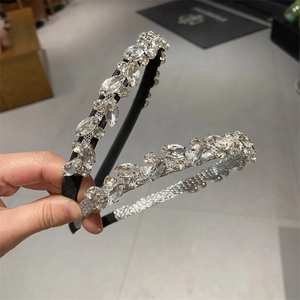Close-up of geometric leaf crystal headbands with sparkling rhinestones set of two