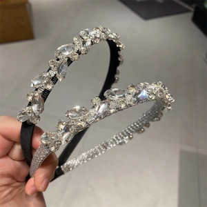 Detailed close-up showing glittering marquise rhinestones on black and silver headbands