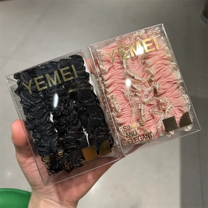 Élastiques à cheveux dentelle épais noirs et roses avec liseré doré, dans une boîte cadeau